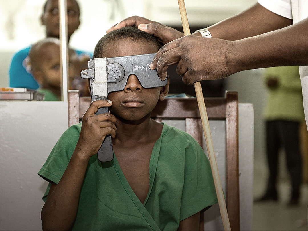 Picture of a child during an ophthalmic screening examination