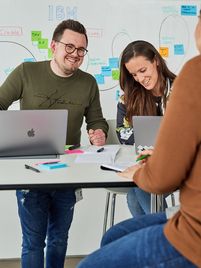 three people working together