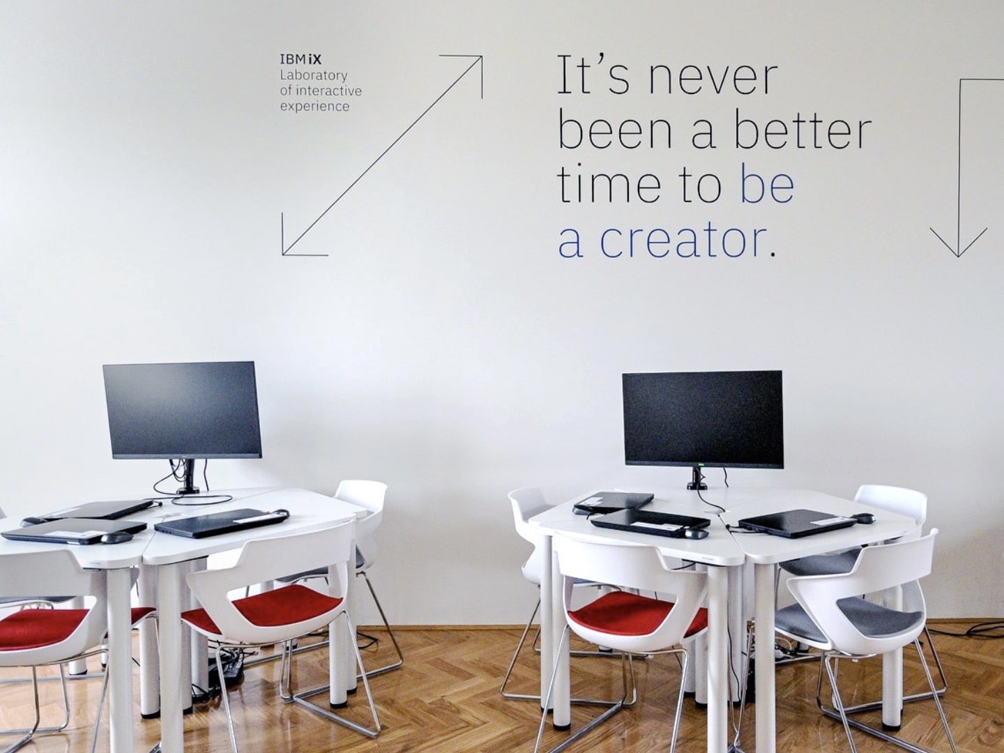 Two chairs with desks, office view and a quote: 