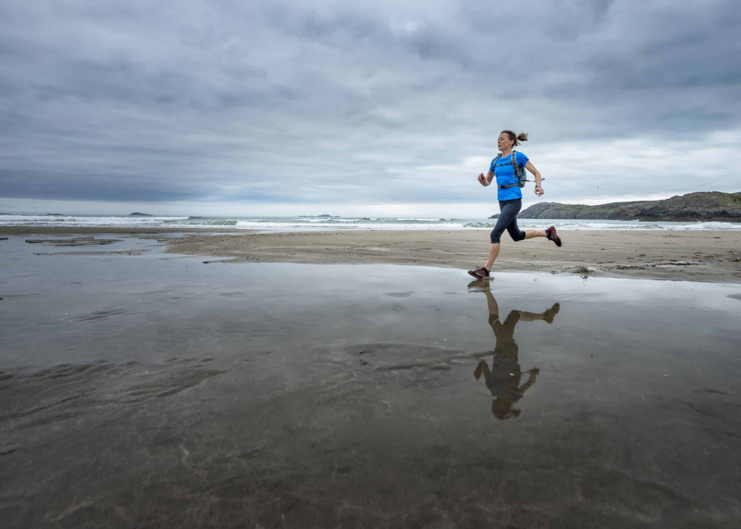 A Woman running on the seaside