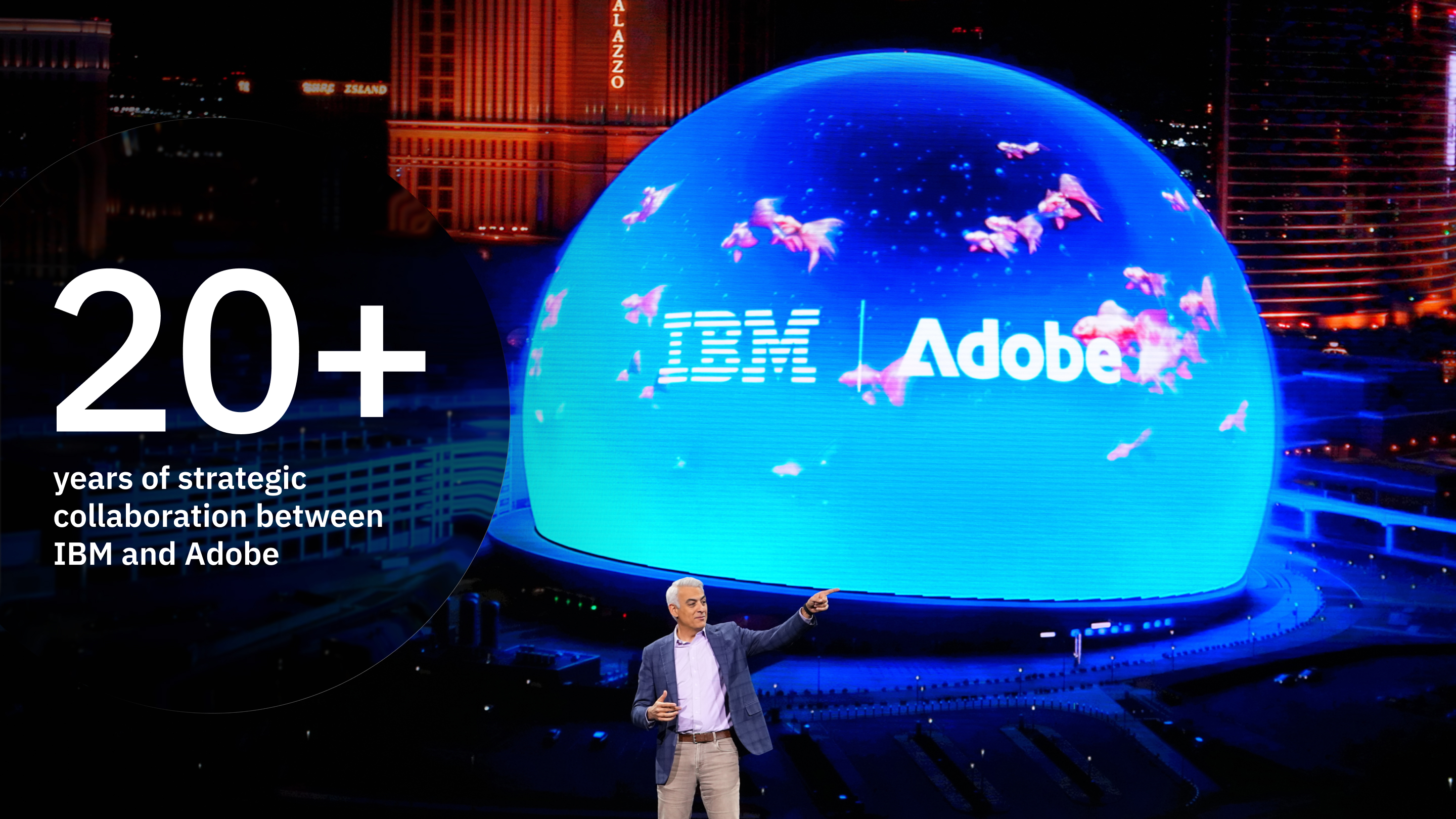 IBM and Adobe celebrate over 20 years of collaboration, highlighting expertise as an Adobe Platinum Solution Partner through a large illuminated event display.