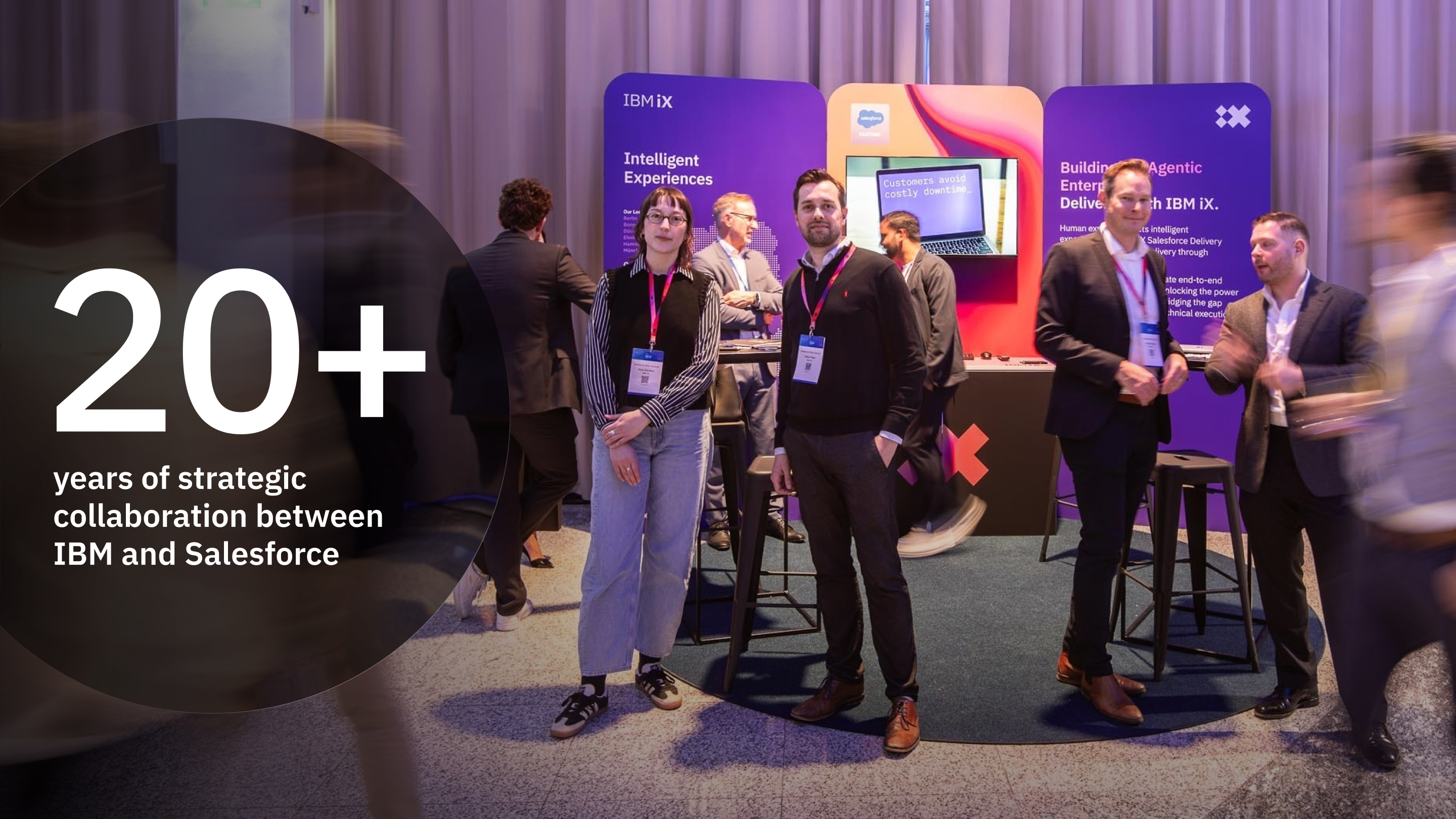 IBM and Adobe celebrate over 20 years of collaboration, highlighting expertise as an Adobe Platinum Solution Partner through a large illuminated event display.